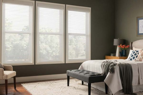 Horizontal Sheer Blinds by Lutron in an olive green bedroom